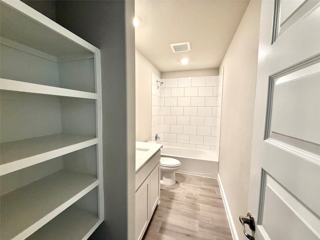 full bath with shower / washtub combination, visible vents, toilet, vanity, and wood finished floors