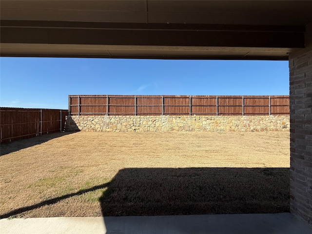 view of yard featuring a fenced backyard