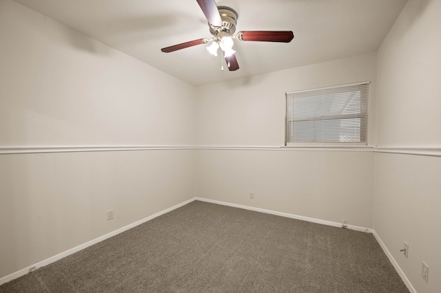 carpeted empty room with baseboards and ceiling fan