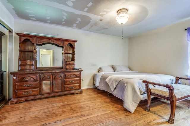 bedroom featuring ceiling fan and light wood-type flooring