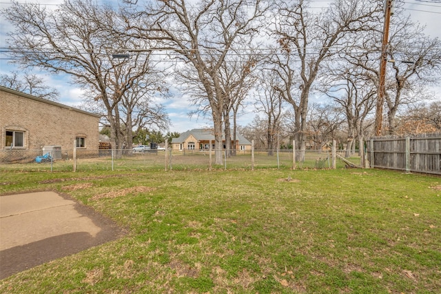 view of yard with a fenced backyard