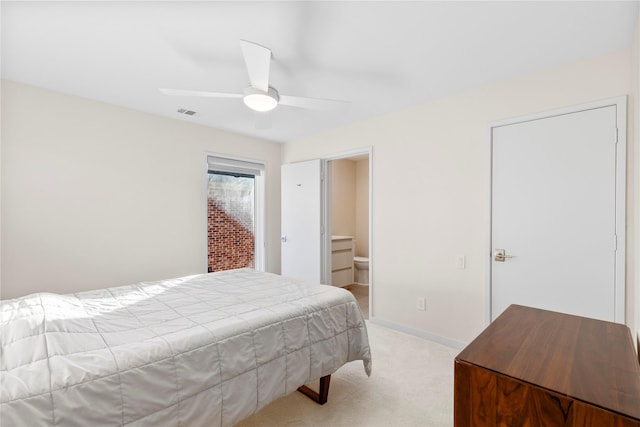 bedroom featuring light carpet, baseboards, and a ceiling fan