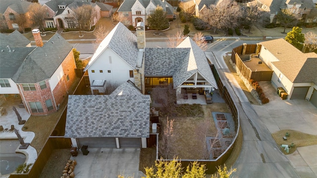 birds eye view of property with a residential view