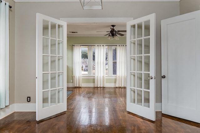 entryway featuring dark wood-style floors, french doors, a ceiling fan, and baseboards