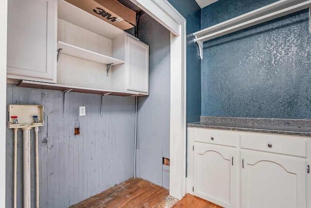 laundry area featuring hookup for a washing machine and light wood-style flooring