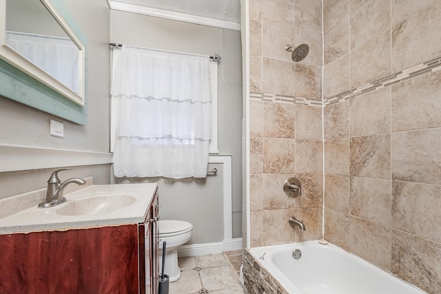 bathroom with baseboards, toilet, shower / tub combination, tile patterned floors, and vanity