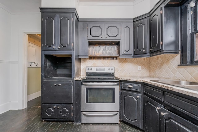 kitchen with baseboards, ornamental molding, decorative backsplash, and stainless steel electric stove