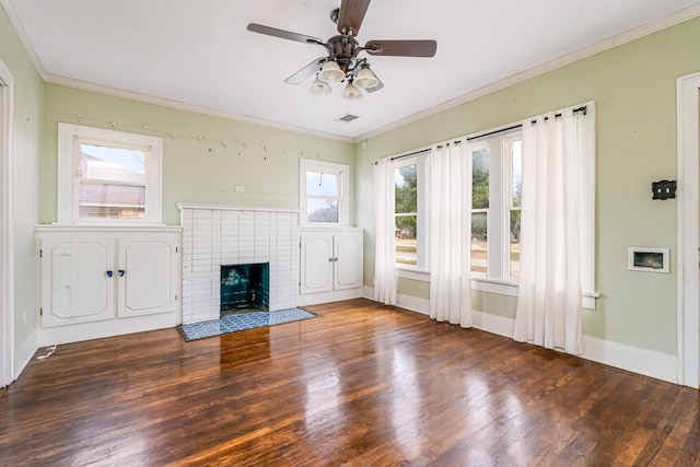 unfurnished living room with dark wood-style floors, a fireplace, visible vents, and crown molding