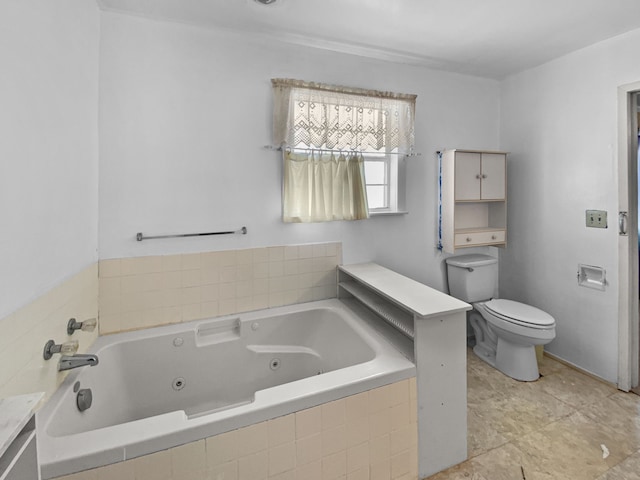 bathroom featuring toilet and a tub with jets