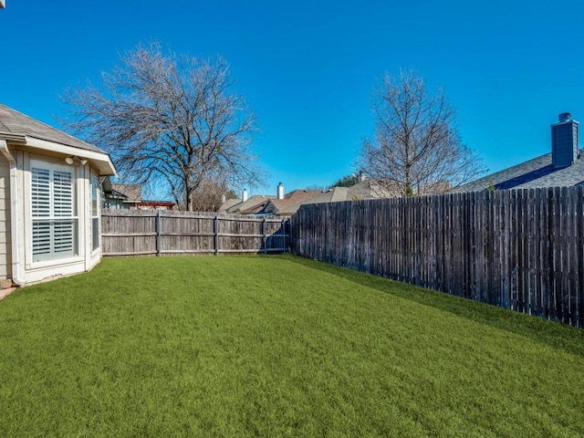 view of yard featuring a fenced backyard