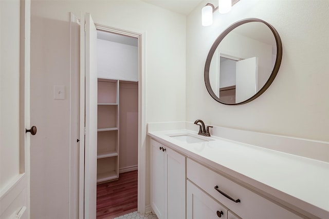 bathroom featuring a closet and vanity