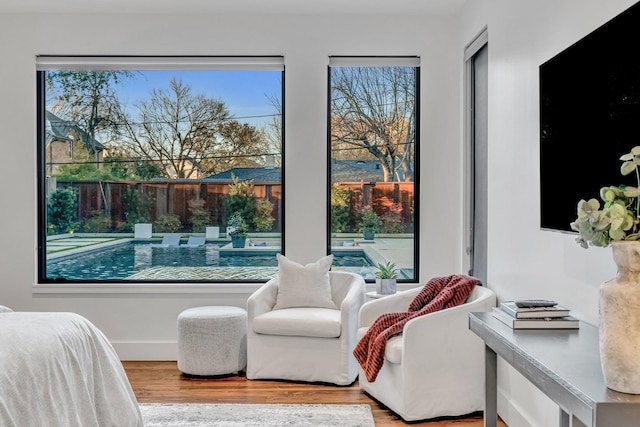 bedroom featuring wood finished floors and baseboards