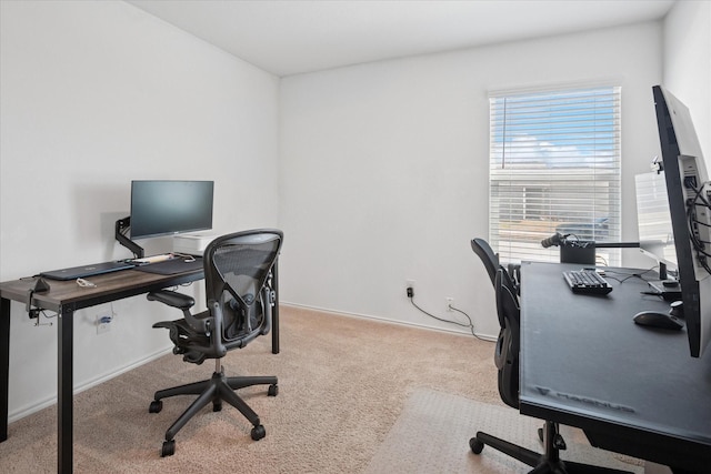 office featuring light colored carpet and baseboards