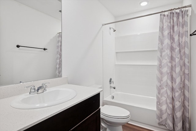 full bathroom with toilet, shower / bathtub combination with curtain, wood finished floors, and vanity