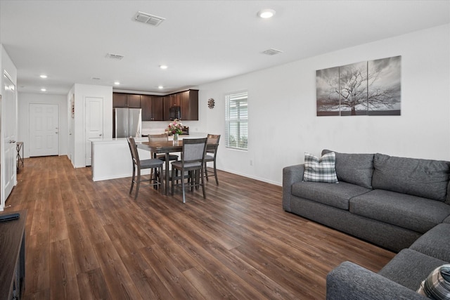 dining room with visible vents, dark wood finished floors, and recessed lighting