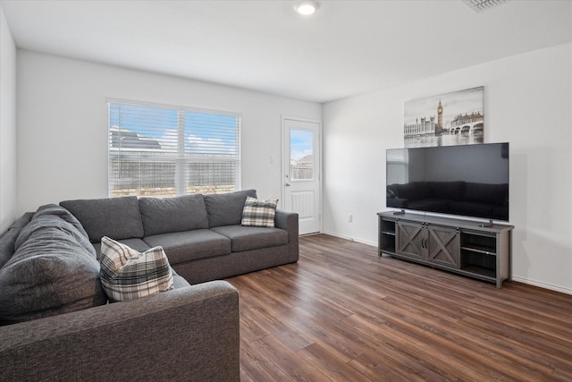 living area with dark wood-style floors and baseboards