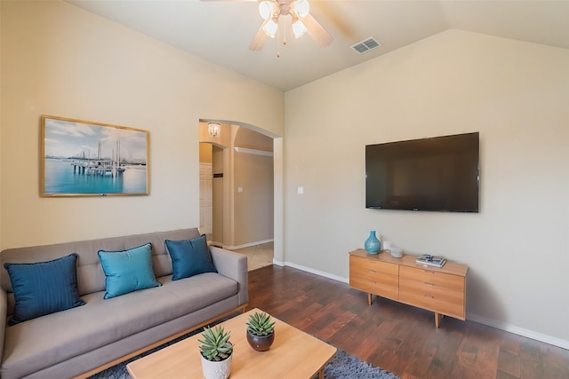 living area featuring visible vents, ceiling fan, lofted ceiling, wood finished floors, and arched walkways