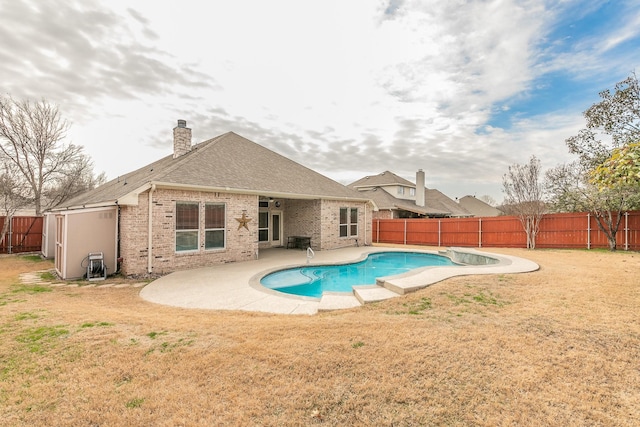 view of swimming pool featuring a fenced backyard, a lawn, a patio, and a fenced in pool