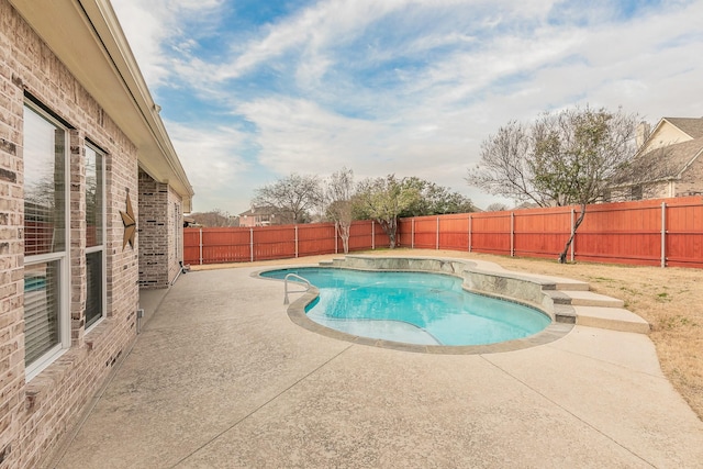 view of pool with a fenced in pool, a fenced backyard, and a patio area