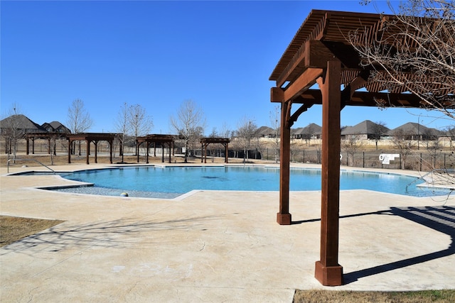 community pool with fence, a patio, a gazebo, and a pergola