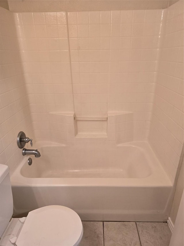 bathroom featuring toilet, shower / bath combination, and tile patterned flooring