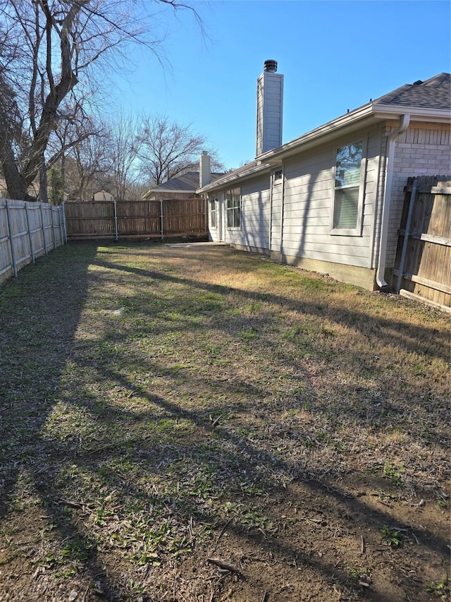 view of yard featuring a fenced backyard