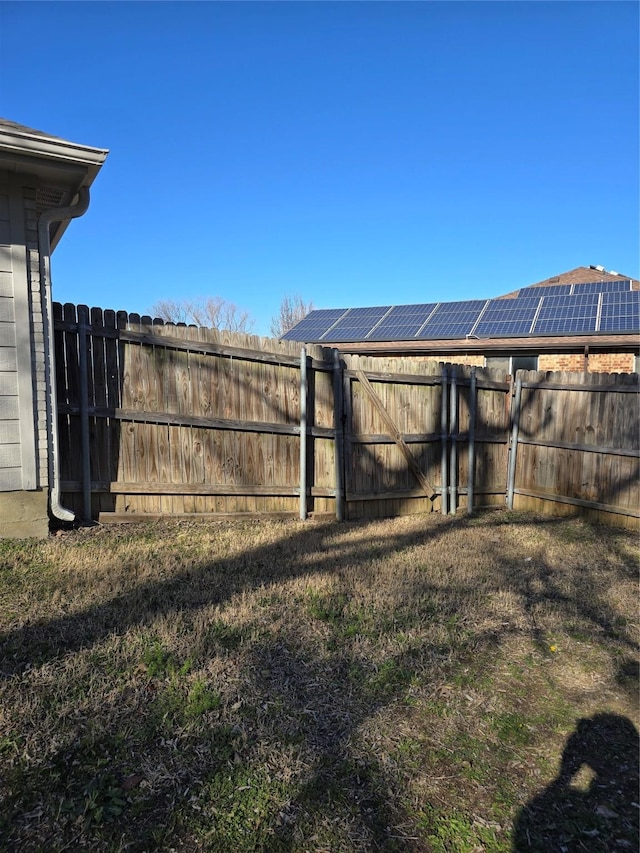 view of yard featuring a gate and fence