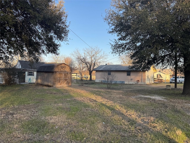 view of yard featuring an outbuilding and a barn