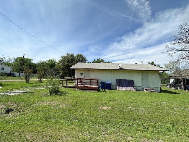 exterior space featuring a deck and a lawn