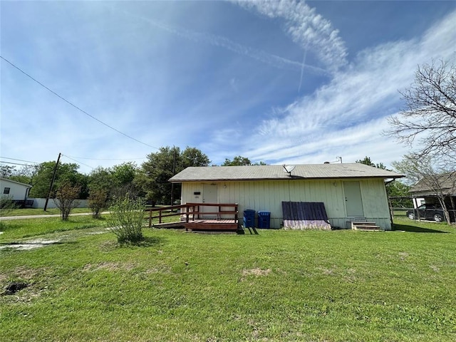 exterior space with a wooden deck and a yard