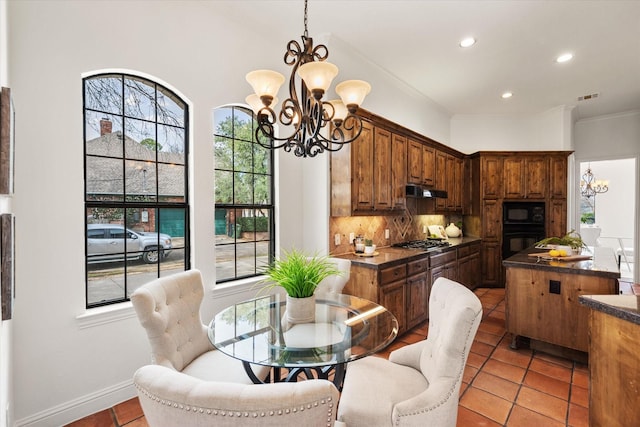 dining room with ornamental molding, recessed lighting, visible vents, and an inviting chandelier