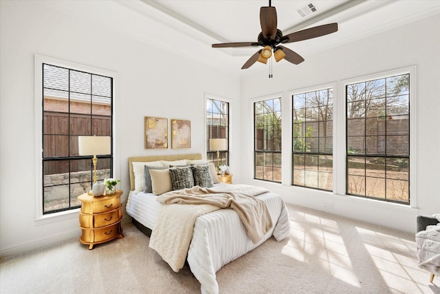 bedroom with baseboards, visible vents, a ceiling fan, crown molding, and carpet flooring