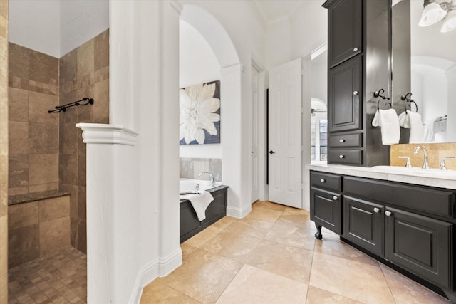 bathroom with ornamental molding, backsplash, walk in shower, and a bath