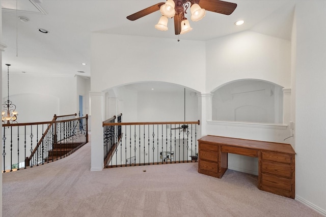 interior space with attic access, recessed lighting, carpet flooring, and ceiling fan with notable chandelier