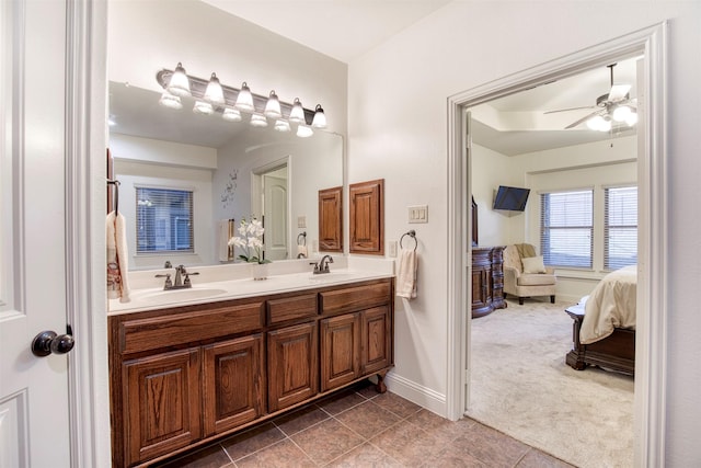 1005 Brendan Dr, Little Elm, TX 75068 - bathroom with connected bathroom, tile patterned flooring, double vanity, a ceiling fan, and baseboards