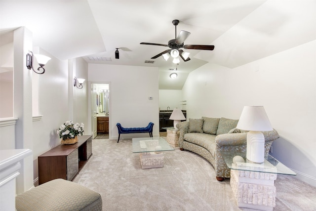 carpeted living room featuring a ceiling fan, visible vents, and baseboards