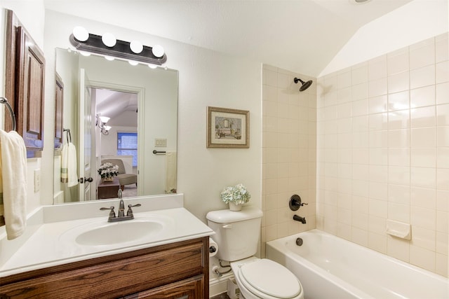 1005 Brendan Dr, Little Elm, TX 75068 - bathroom featuring lofted ceiling, vanity, shower / bathtub combination, and toilet