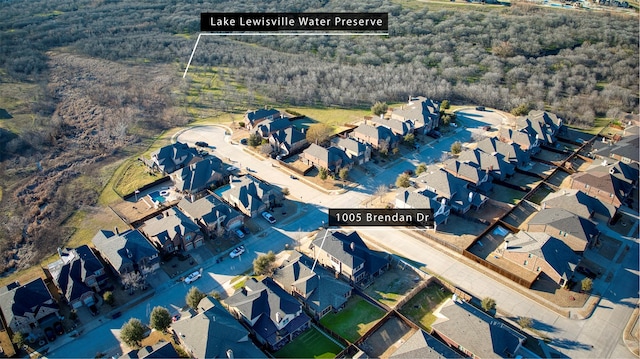 aerial view with a residential view and a view of trees