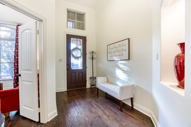 entrance foyer with wood finished floors and baseboards