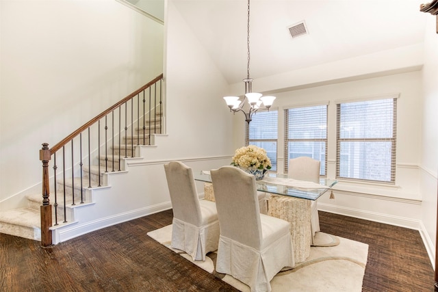 dining space featuring visible vents, baseboards, stairway, dark wood finished floors, and an inviting chandelier