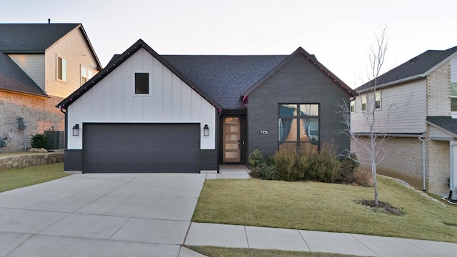 view of front facade with a garage, concrete driveway, cooling unit, board and batten siding, and a front yard