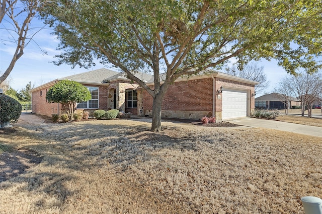 ranch-style house featuring driveway, an attached garage, and brick siding