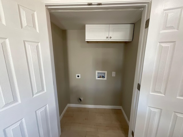 laundry room featuring baseboards, washer hookup, cabinet space, and electric dryer hookup