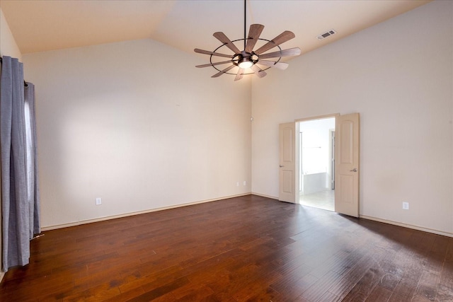 empty room with dark wood-style floors, visible vents, baseboards, and a ceiling fan