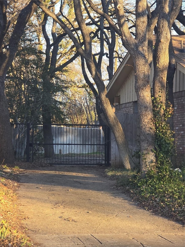 view of gate with fence