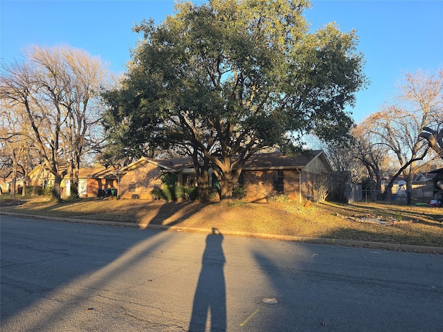 view of front facade with a residential view and driveway