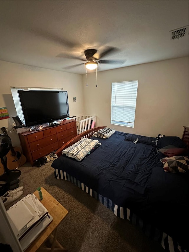 bedroom featuring ceiling fan, carpet, and visible vents