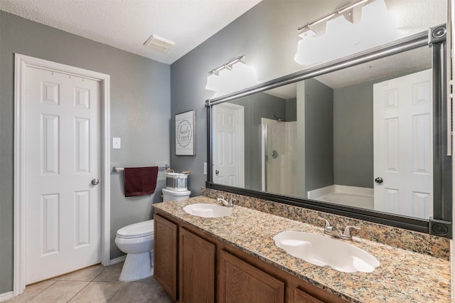 full bathroom featuring a walk in shower, double vanity, a sink, and visible vents