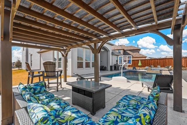 view of patio / terrace featuring fence, outdoor lounge area, and a fenced in pool