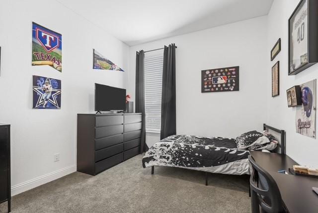 bedroom with baseboards and carpet flooring